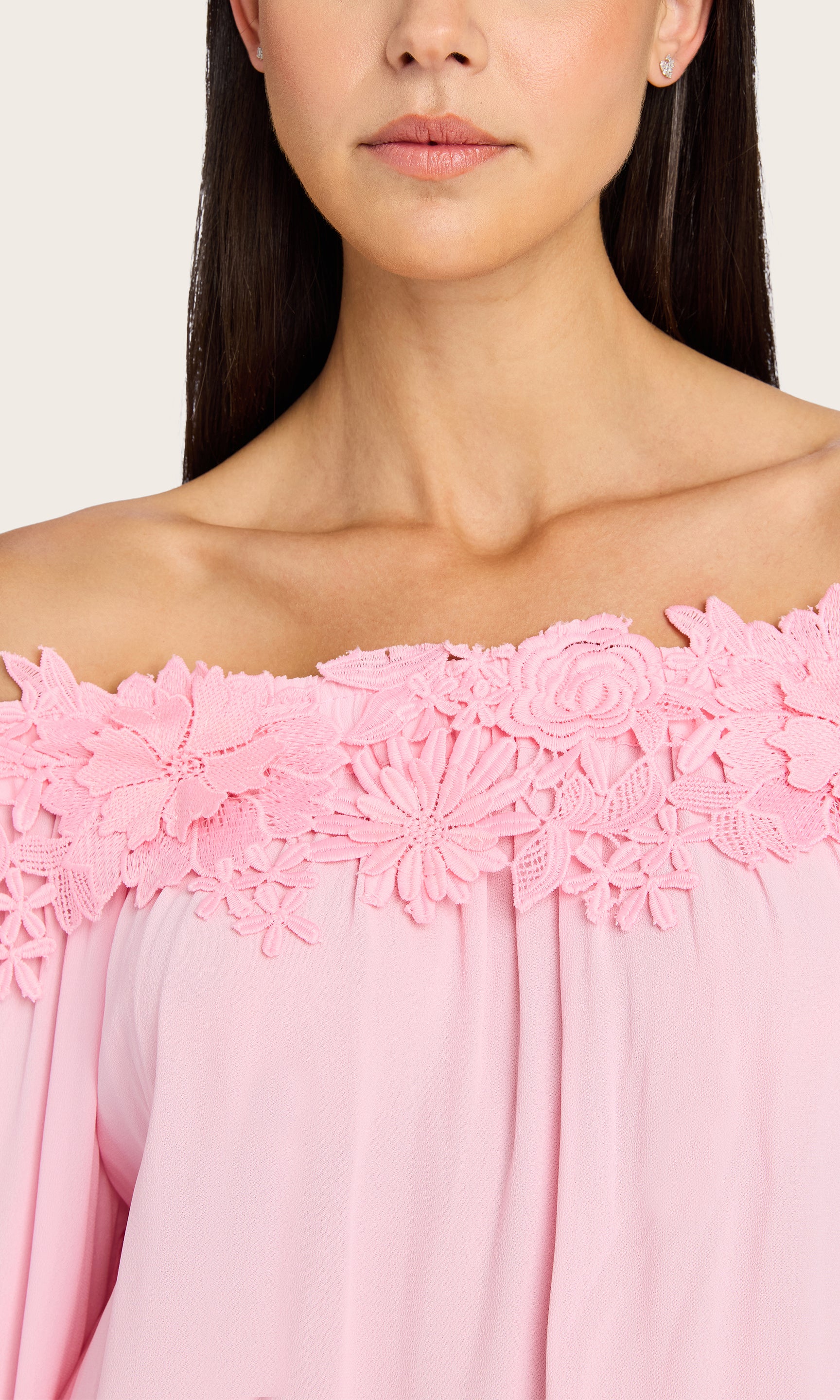 A close-up of the model shows the delicate floral lace trim and soft pleats along the neckline of the Merla Lace Combo Blouse.