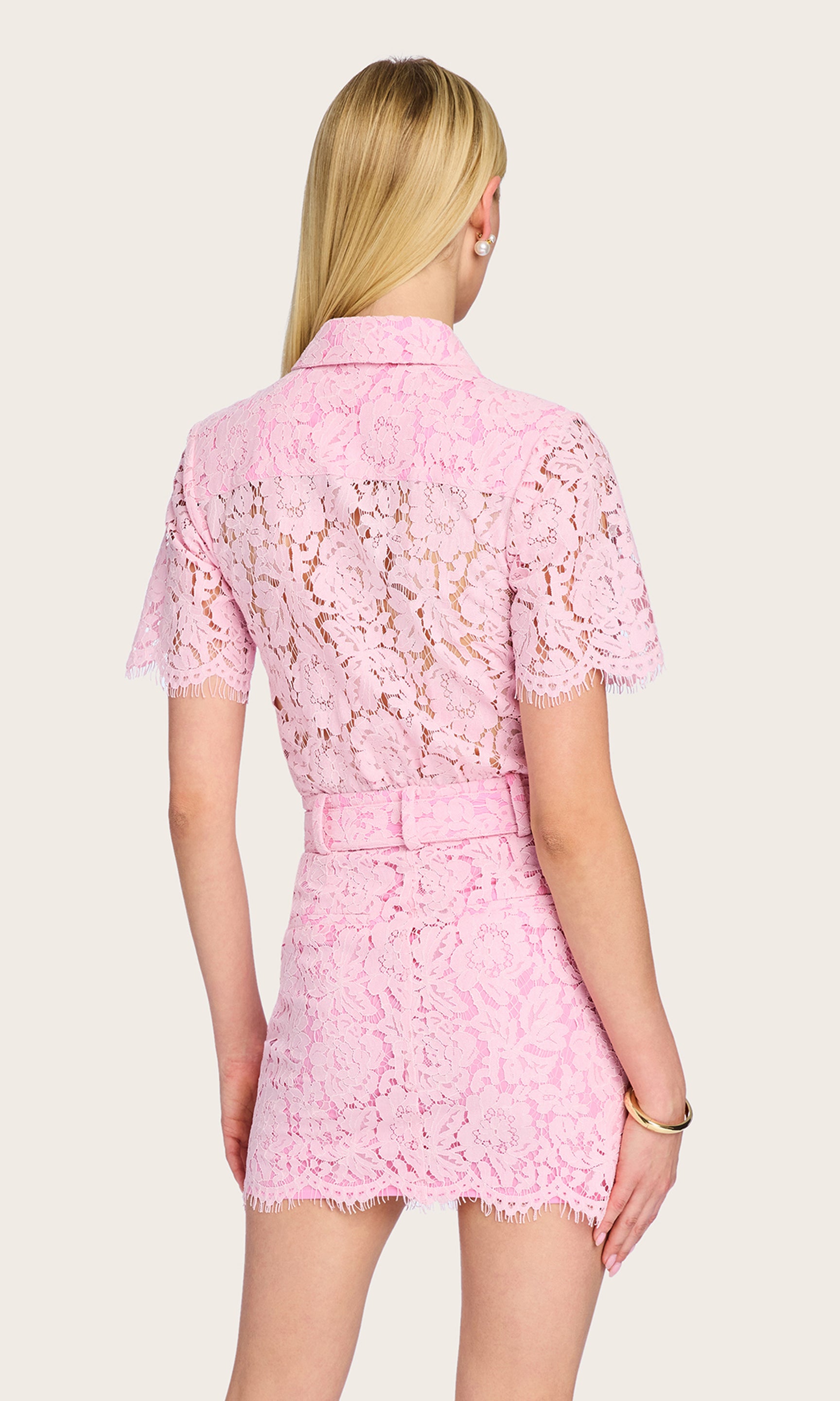 Rear view of the Morgana Lace Dress highlighting the back silhouette and hemline.