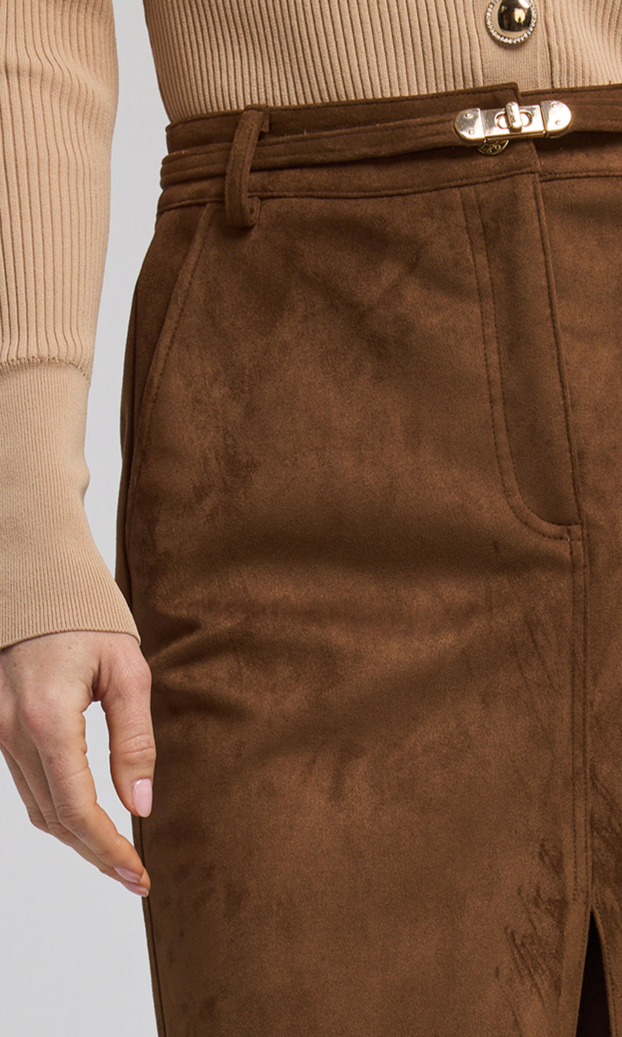 A caramel vegan suede skirt featuring a stylish front slit, combining elegance with sustainable fashion. 