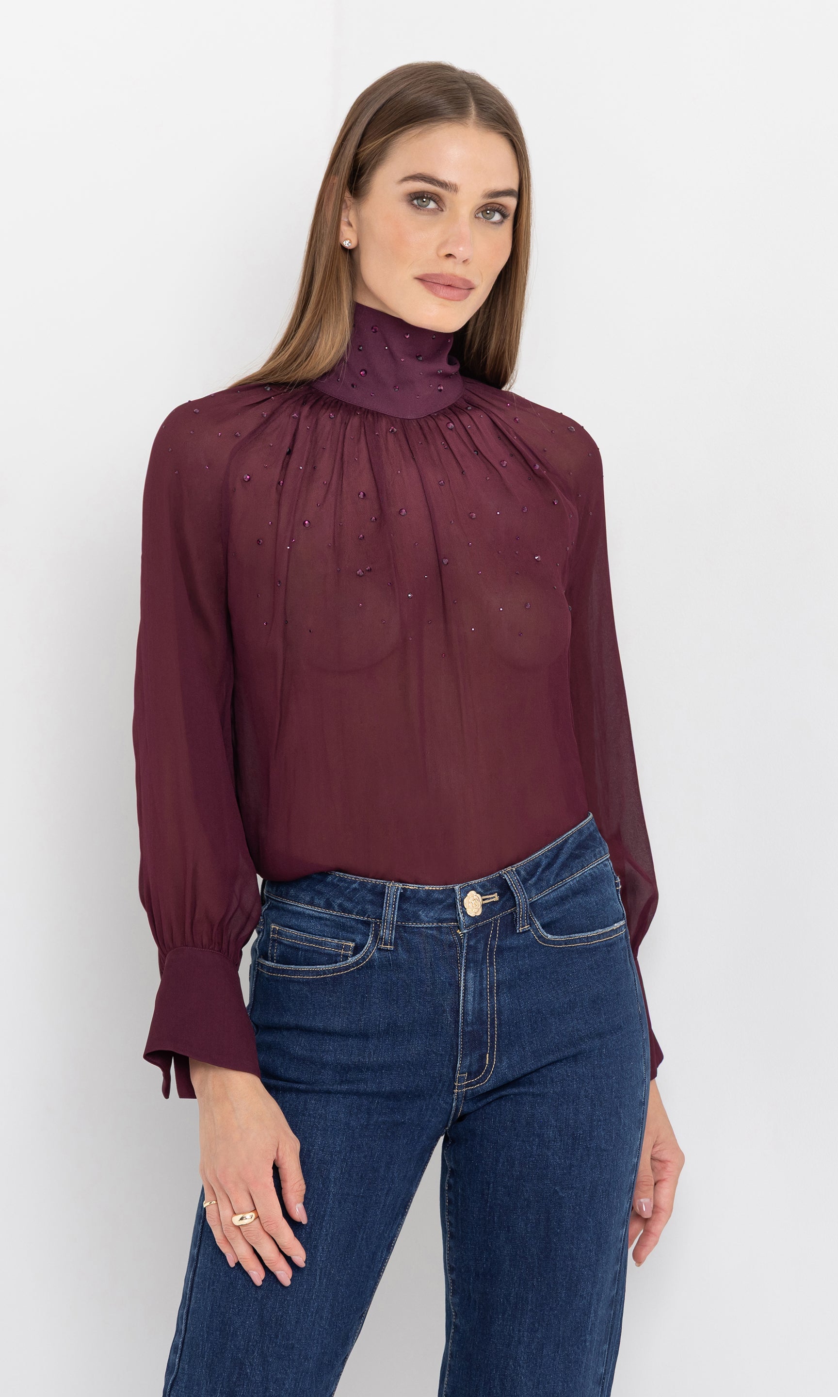 Front view of the noor crystal blouse styled with denim.