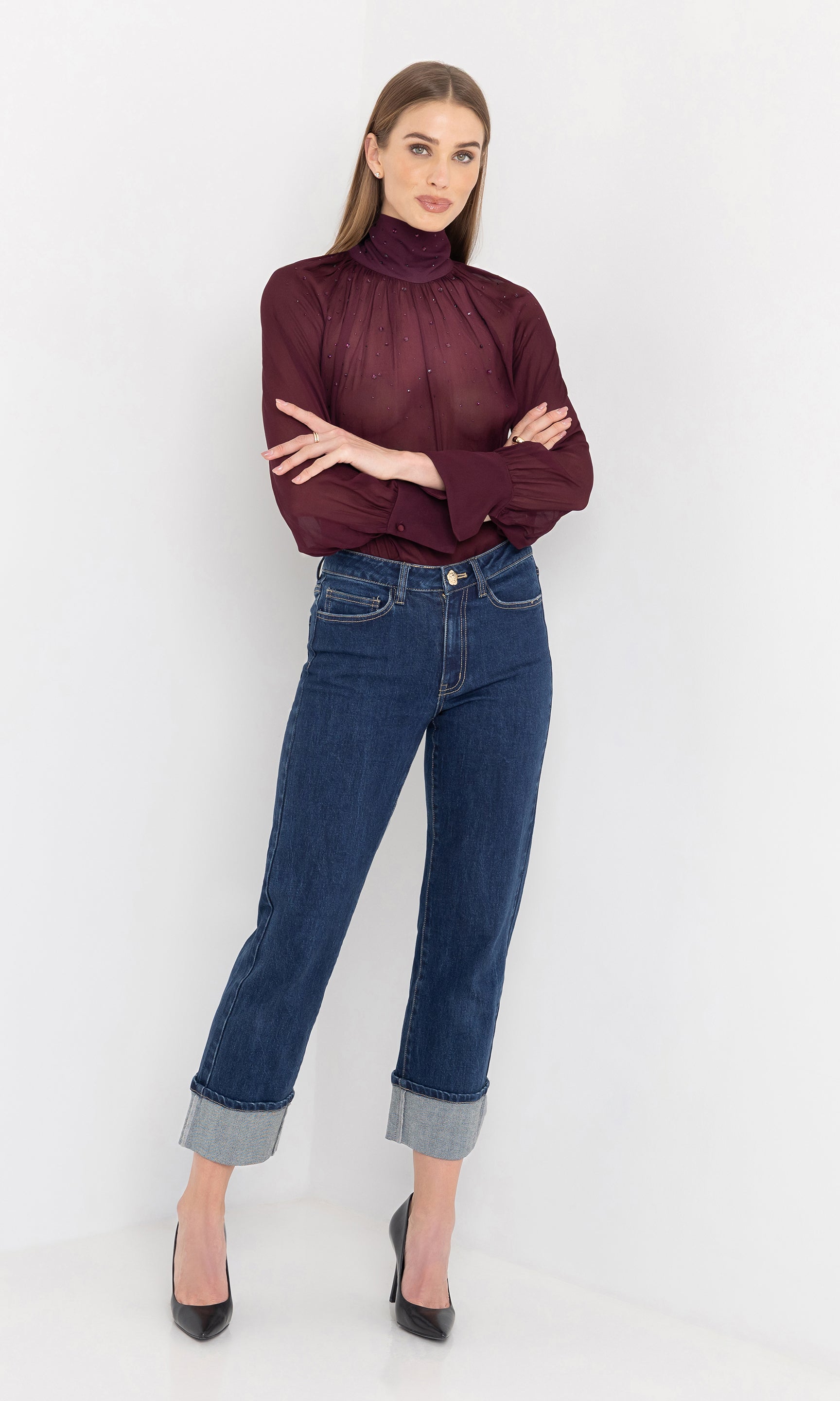 Full body front view of the noor crystal blouse with arms crossed.