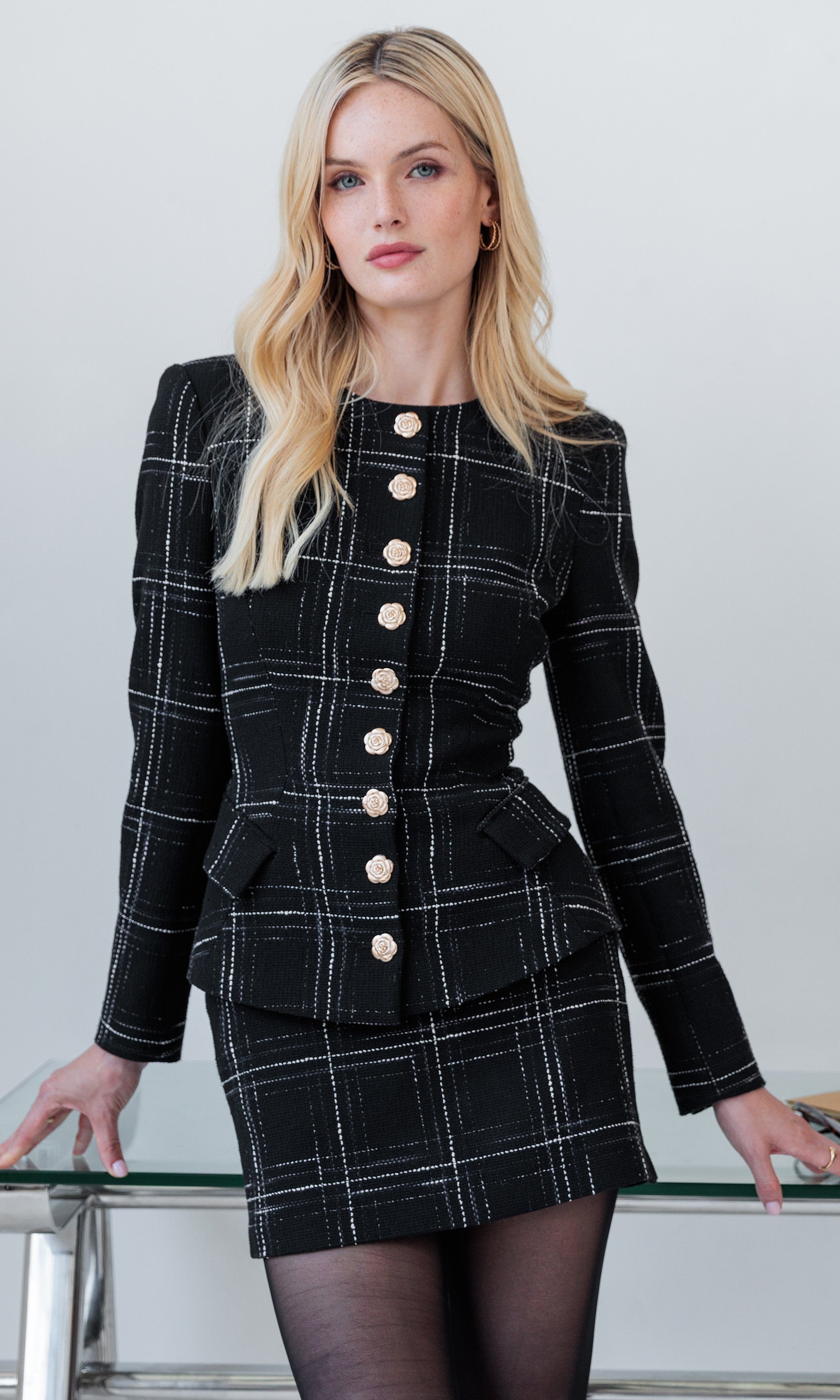 The model wears the Ophelia Windowpane Tweed Jacket in a front view, showcasing its gold button details and fitted silhouette.