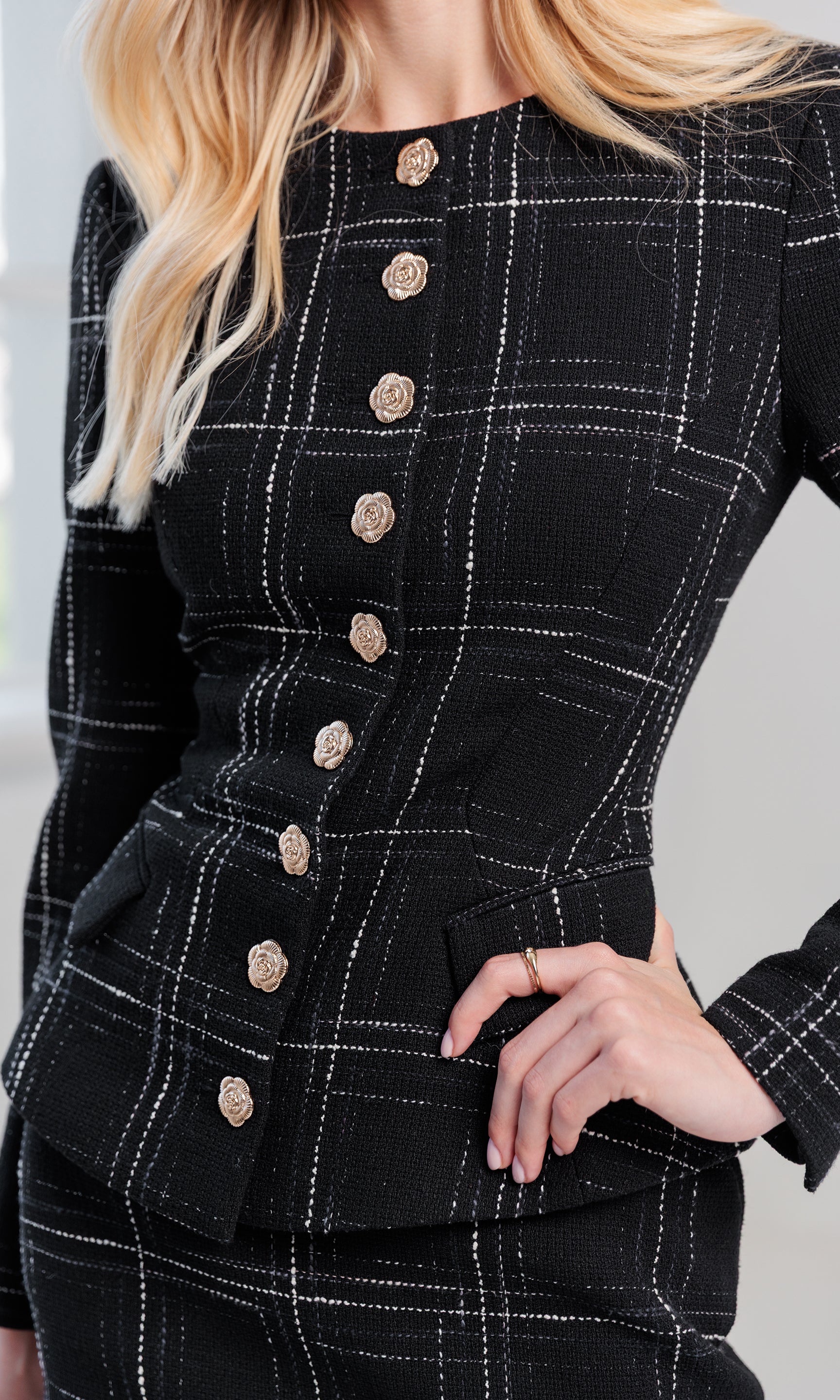 Side view of the model wearing the Ophelia Windowpane Tweed Jacket, highlighting its structured shoulders and tailored fit.