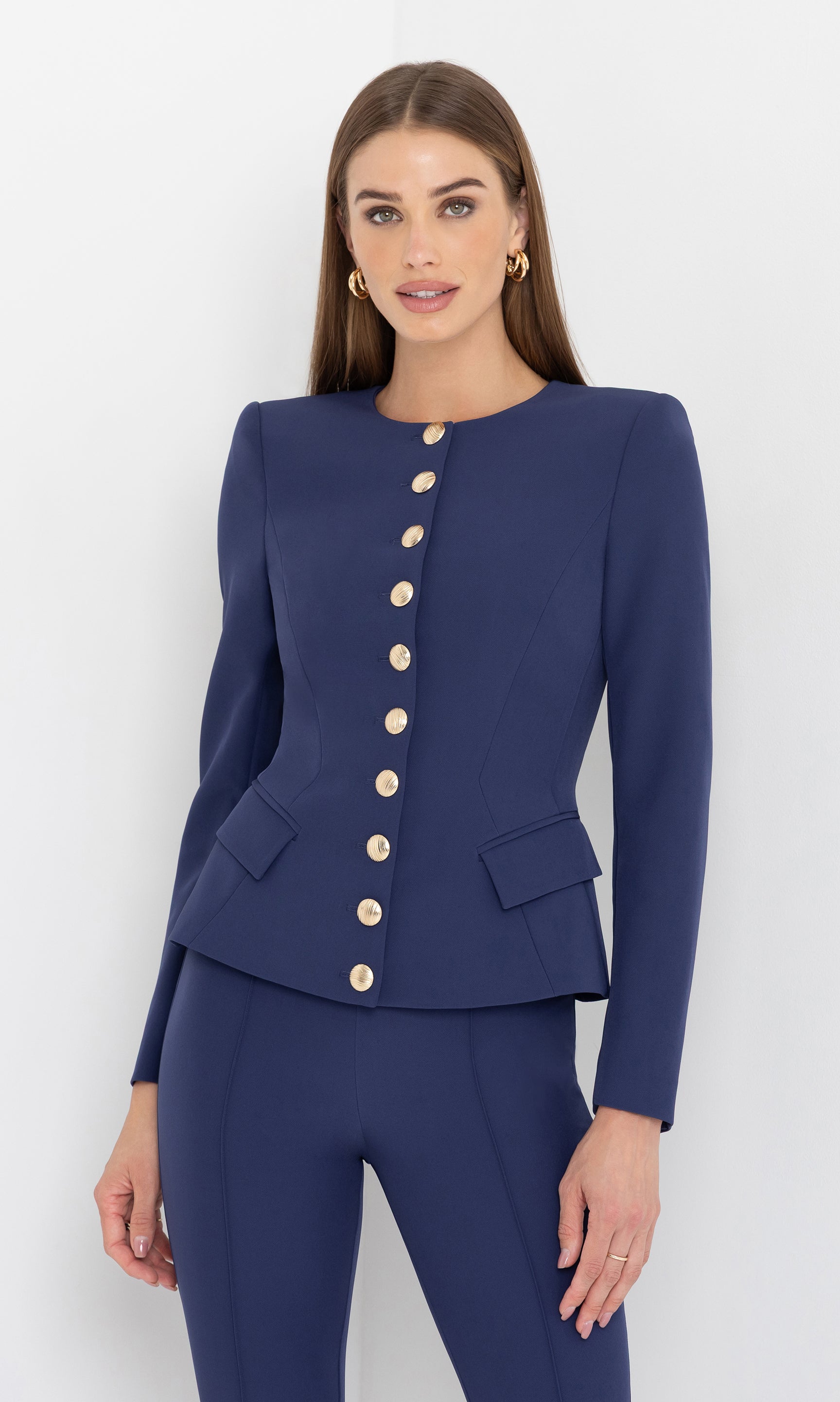Front view of the model wearing the ophelia crepe jacket with structured tailoring and gold button detailing.