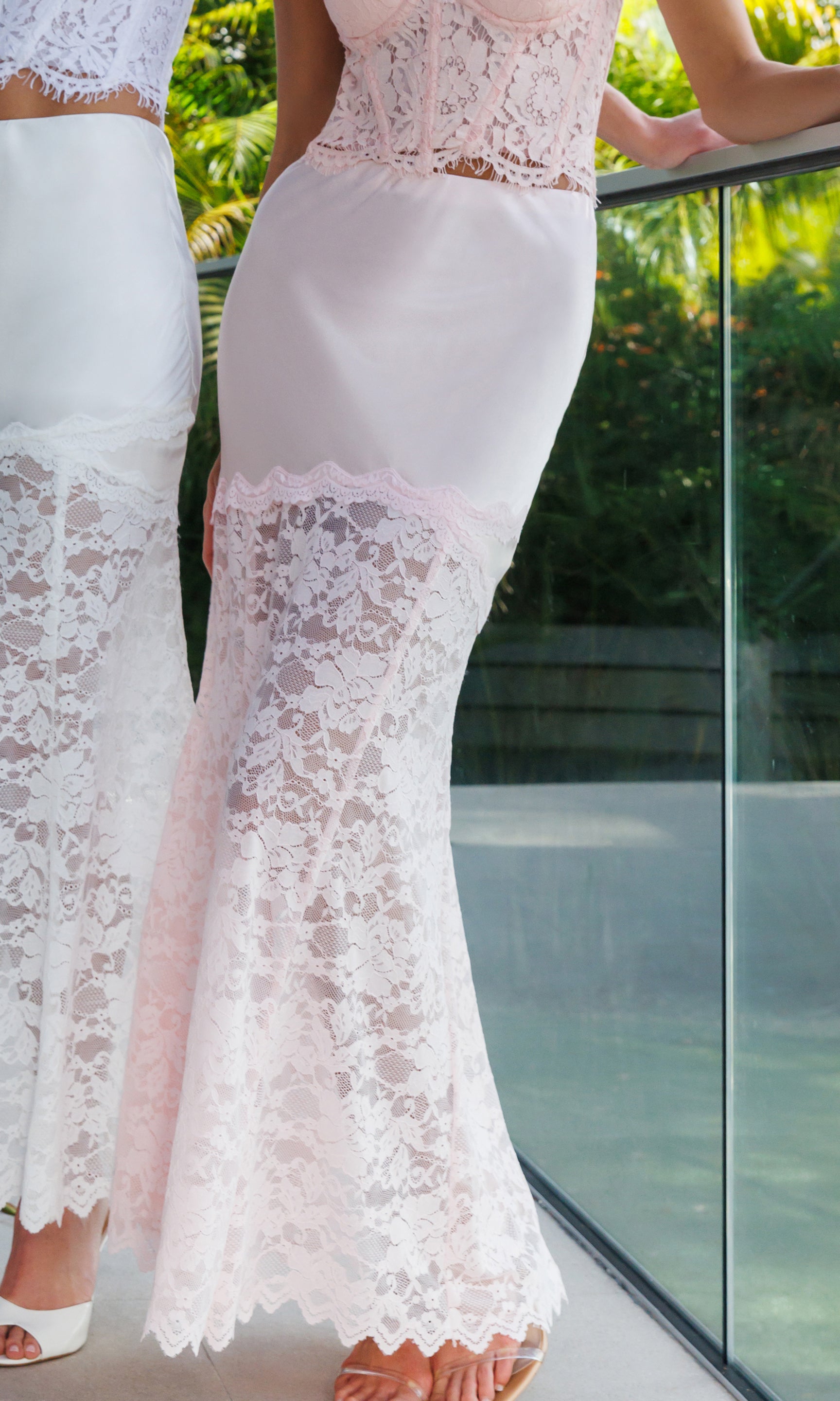 White lace skirt with a blurred outdoor background