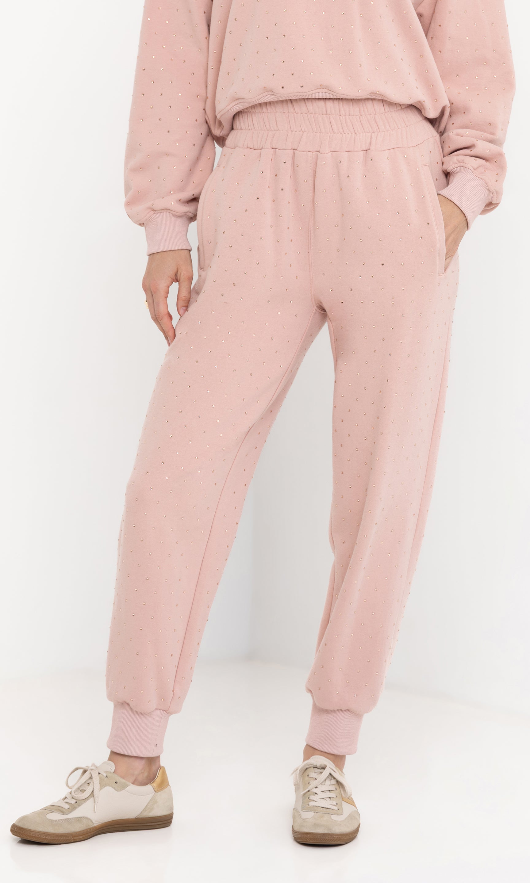 Front view of the model wearing the ruel crystal sweatpants with elastic waistband.