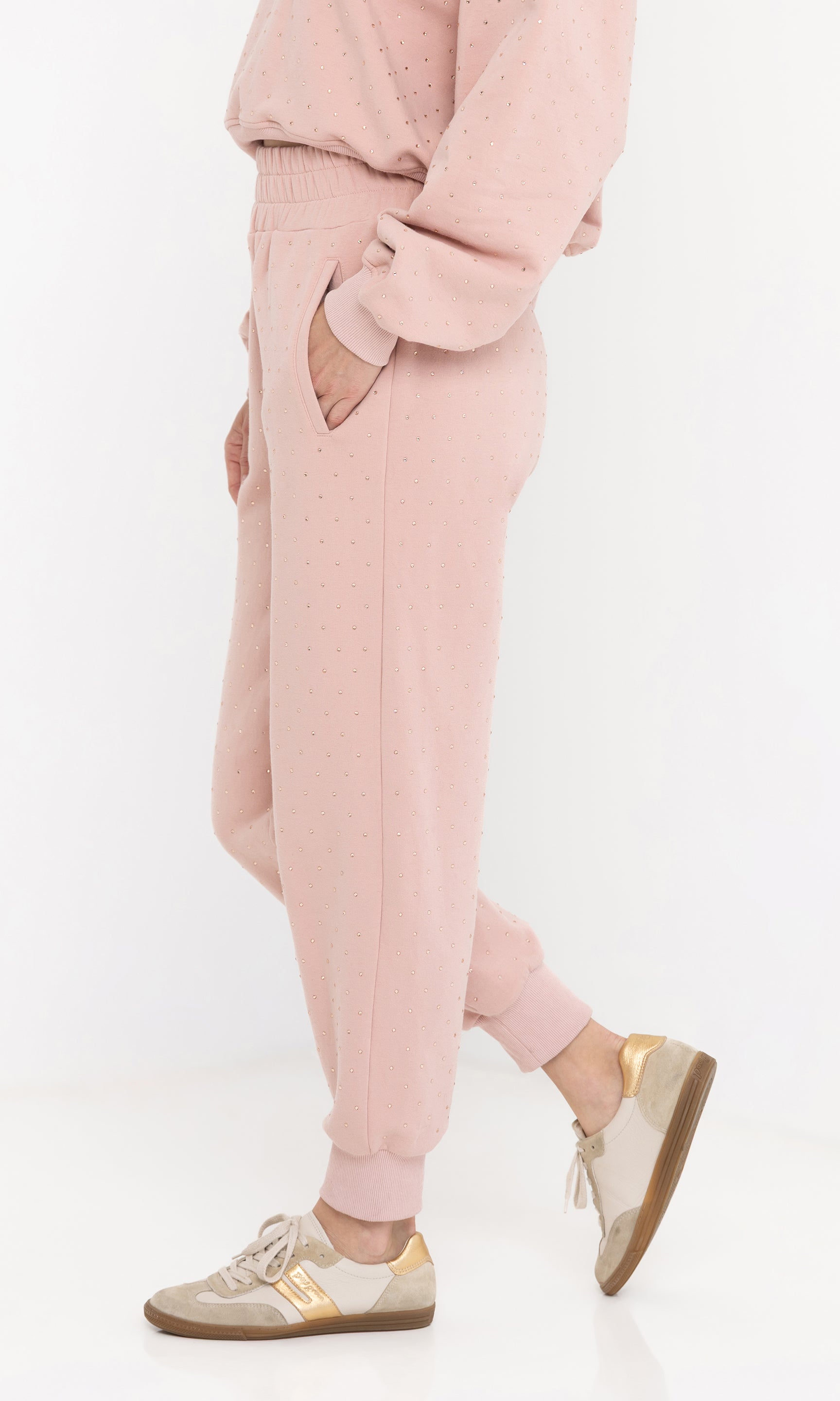 Side view of the ruel crystal sweatpants showing the jogger fit.