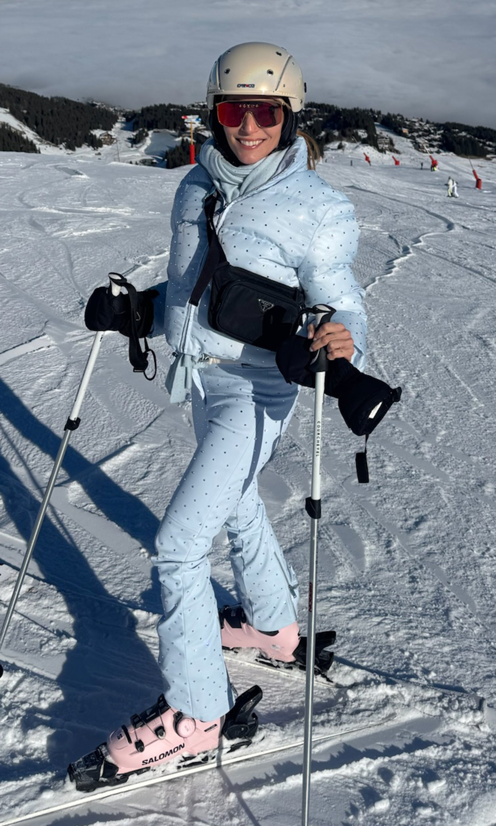 Person skiing on a snowy slope with ski equipment