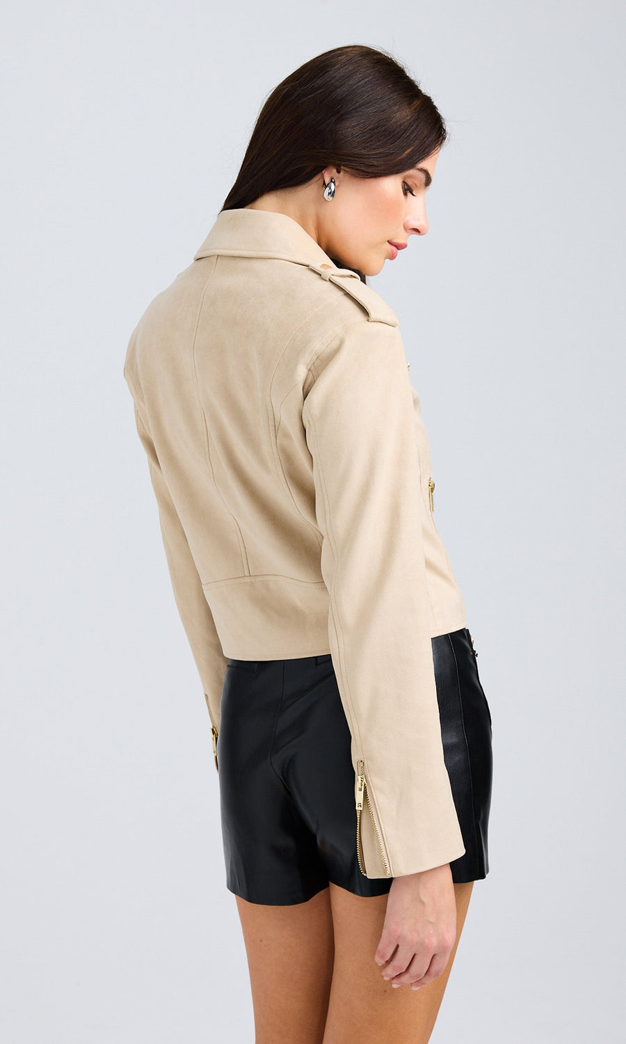 Rear view of the sand vegan suede moto jacket, displaying its clean back design and structured fit.