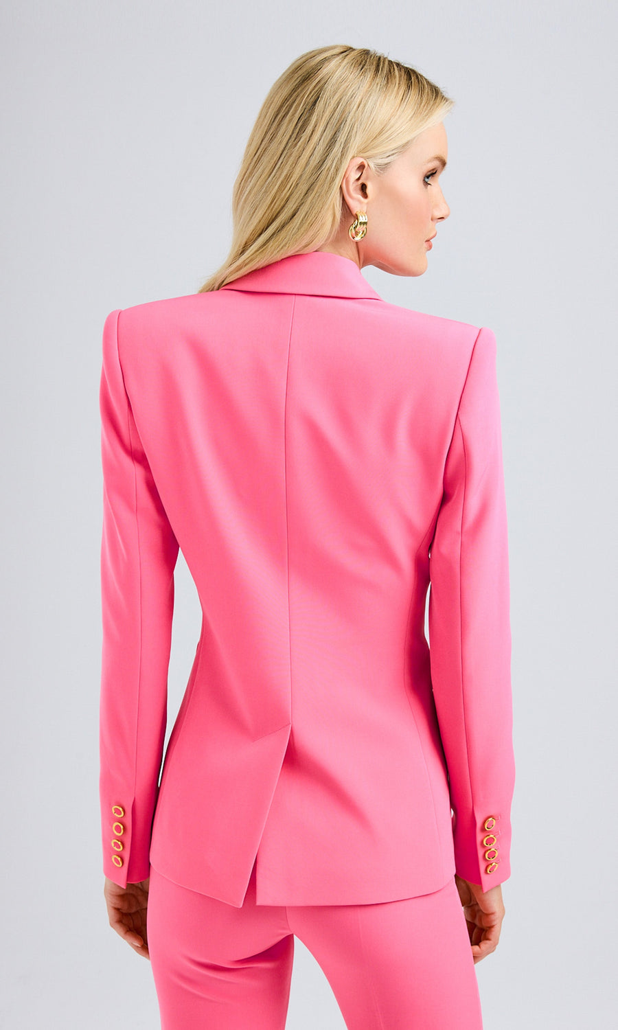 Back view capturing the smooth tailoring and streamlined finish of the blazer, emphasizing its clean structure