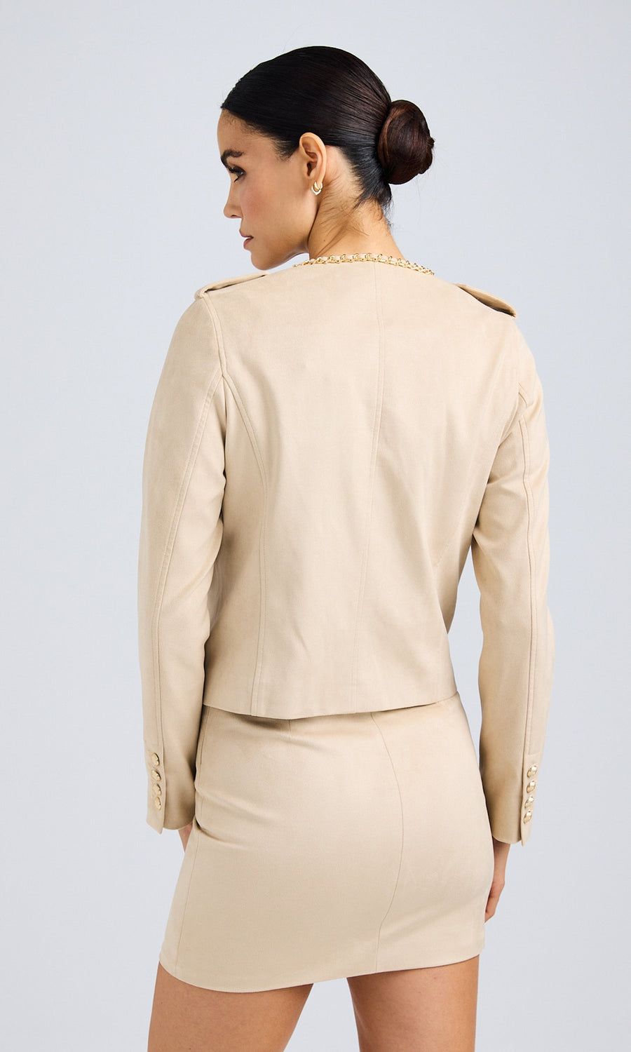 Rear view of the sand vegan suede jacket, emphasizing its clean back design.