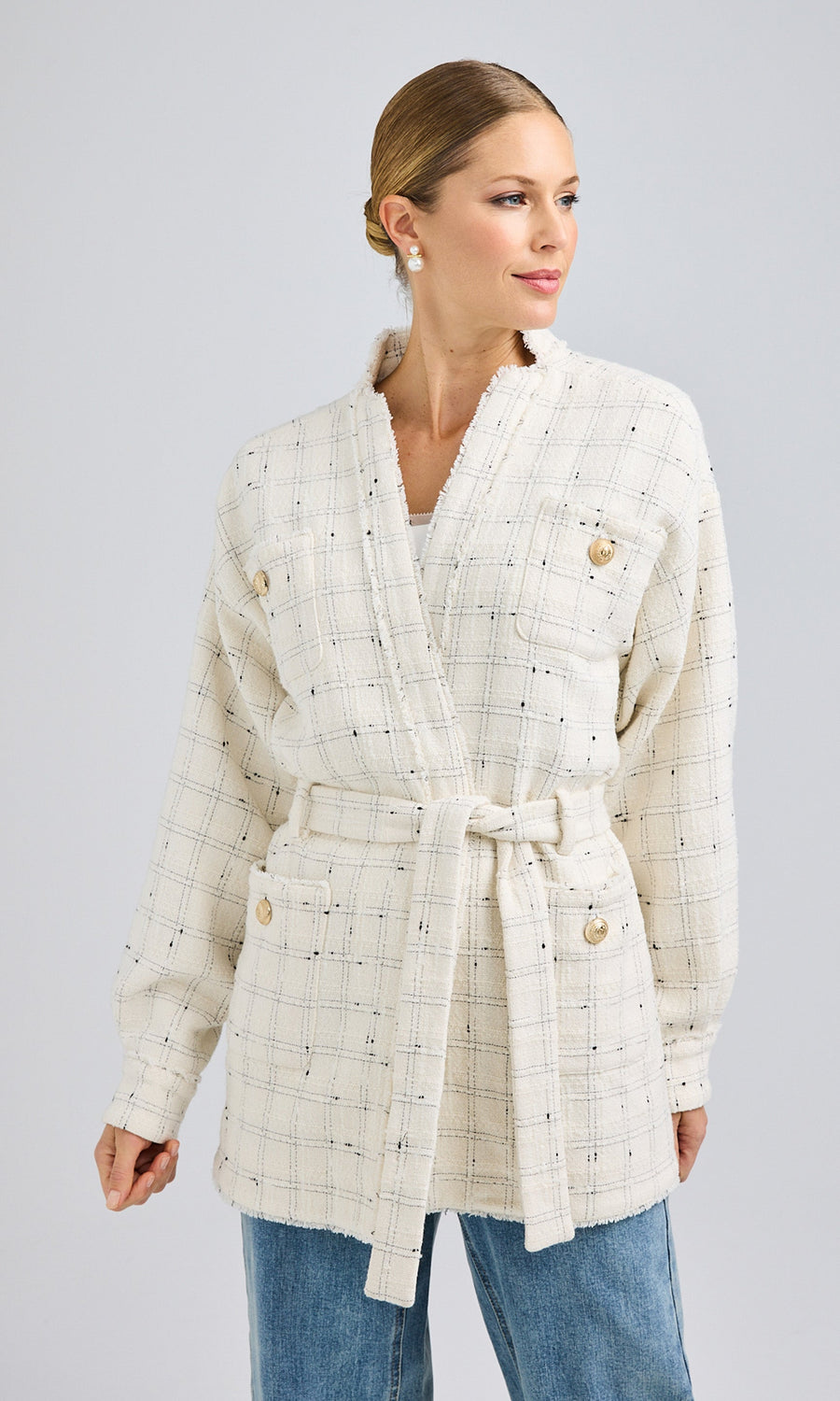 Front view of the Lainey Tweed Jacket styled open, showcasing its relaxed boyfriend fit, textured tweed fabric, and gold laurel wreath shield buttons, paired with light-wash denim.