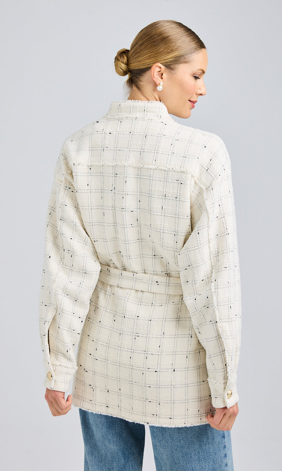 Rear view showcasing the back seam detailing and straight hemline of the Lainey Tweed Jacket, complementing its elegant tweed texture.