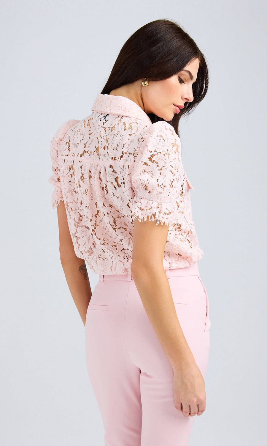 Back view highlighting the delicate lace construction and scalloped hemline