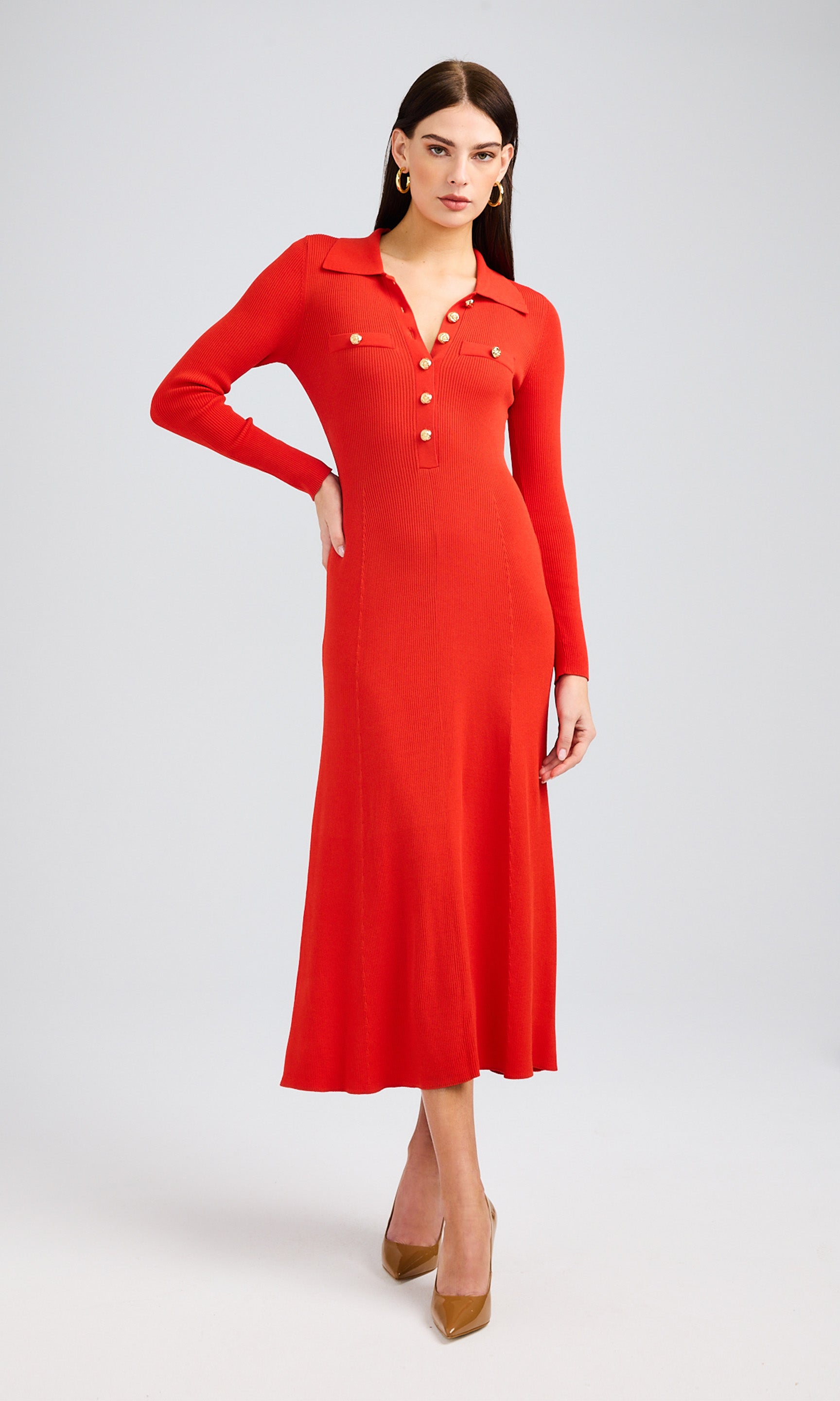 A flame-colored dress made from soft knit material, highlighting its comfort and fashionable look