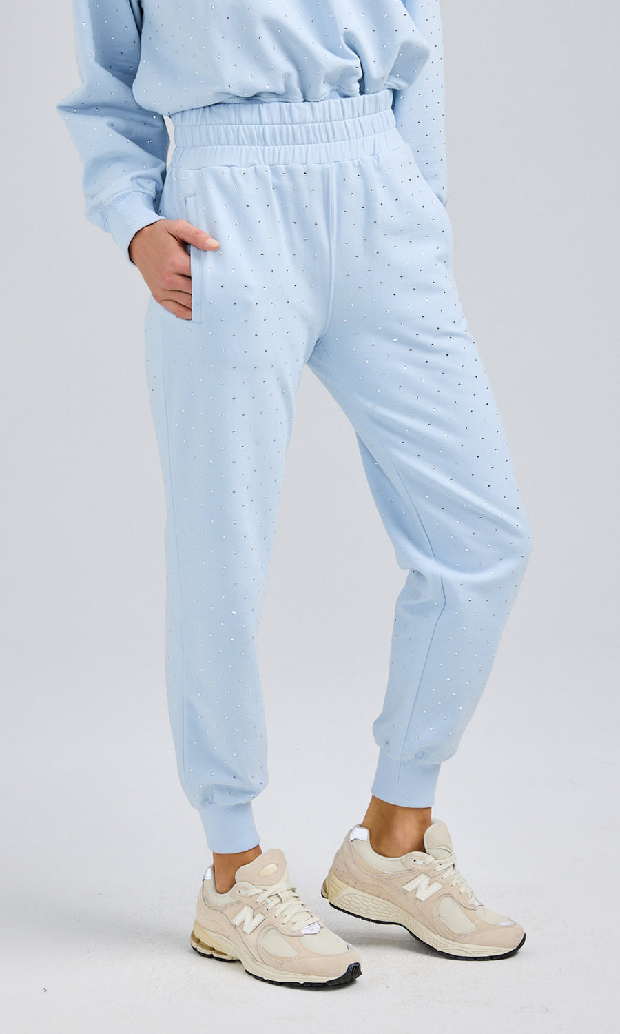 Soft, lightweight blue sweatpants made from comfortable material, perfect for casual wear or lounging at home.