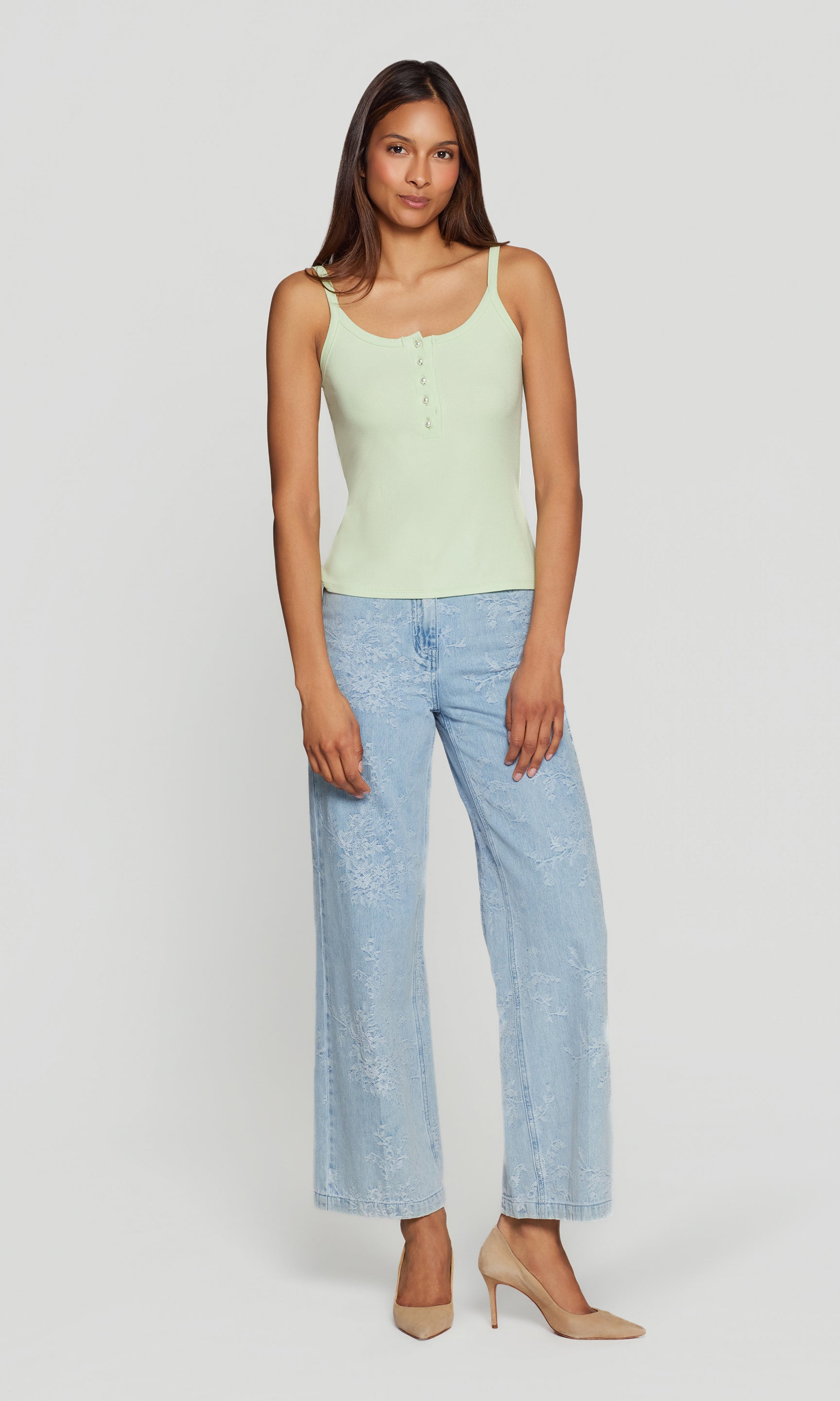 The model appears in a full body front view wearing the Molly Rib Tank Top in mint with wide-leg denim, showing the flattering longline tank shape.
