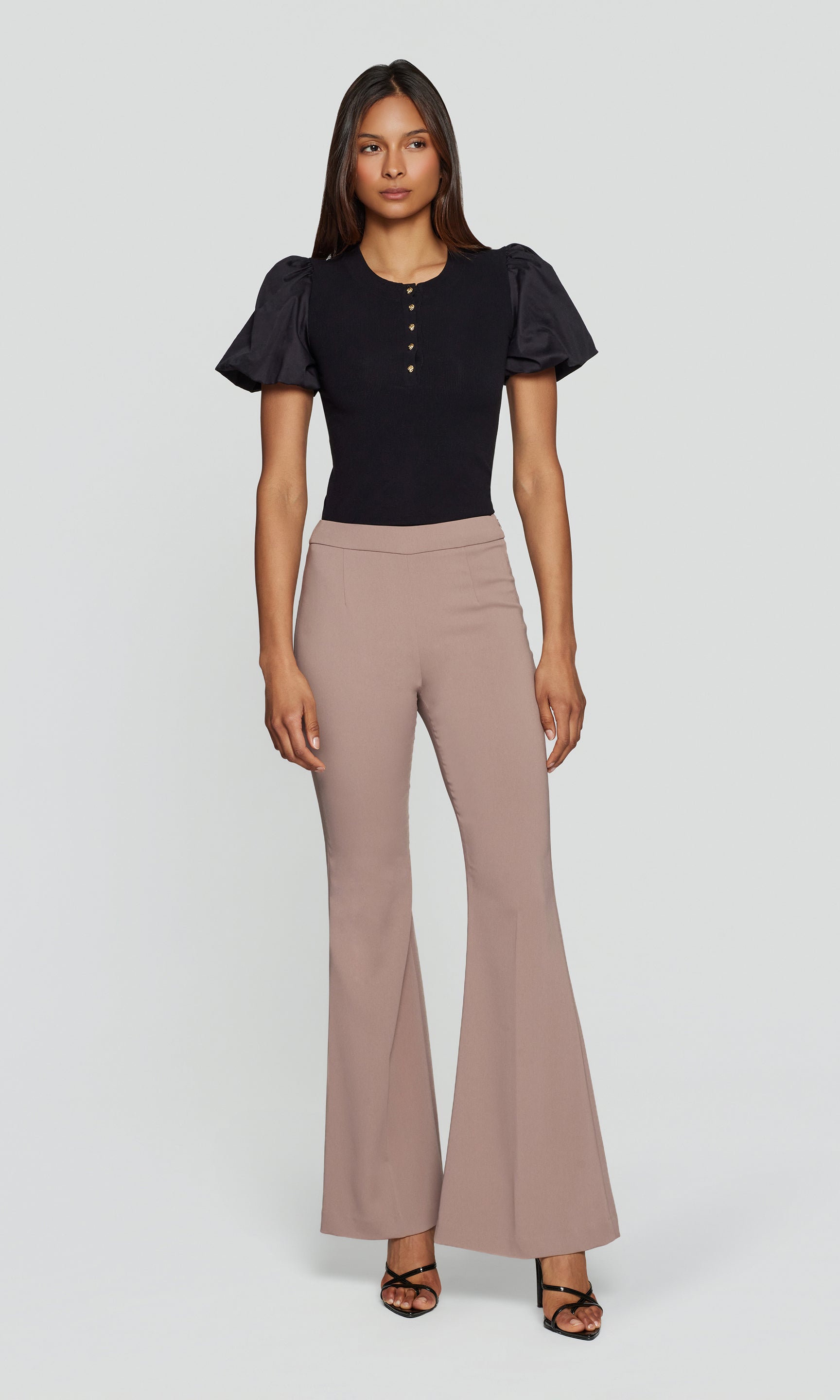 Model wears the taupe Wesley Crepe Pants in a studio full body view, styled with a black top to show the full length and proportion.