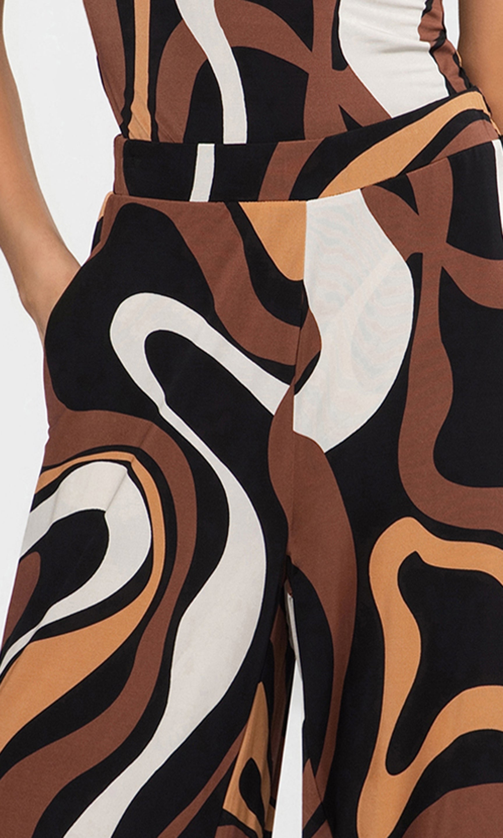 Close-up of a patterned pants with brown, black, and white design.