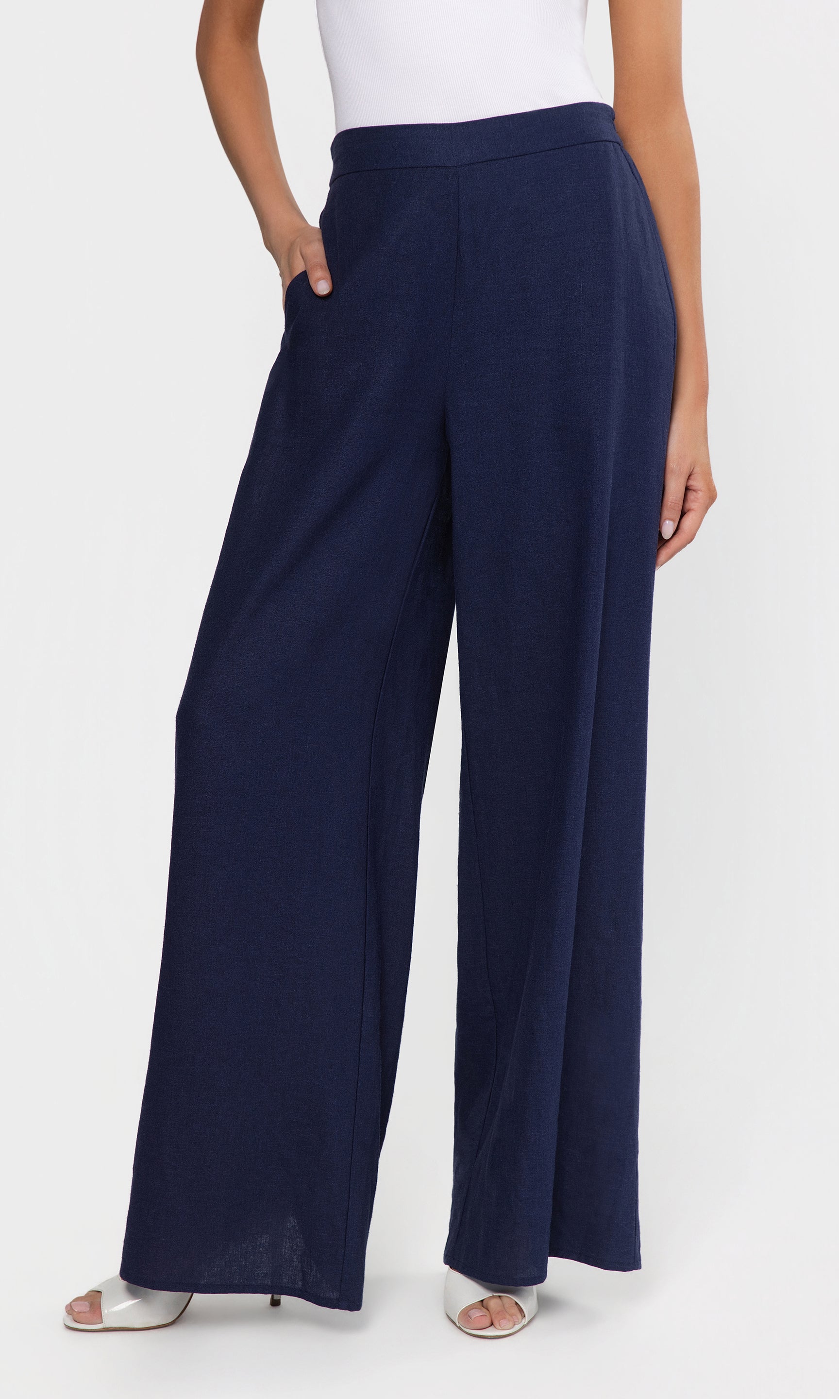 Navy wide-leg pants worn by a person on a white background