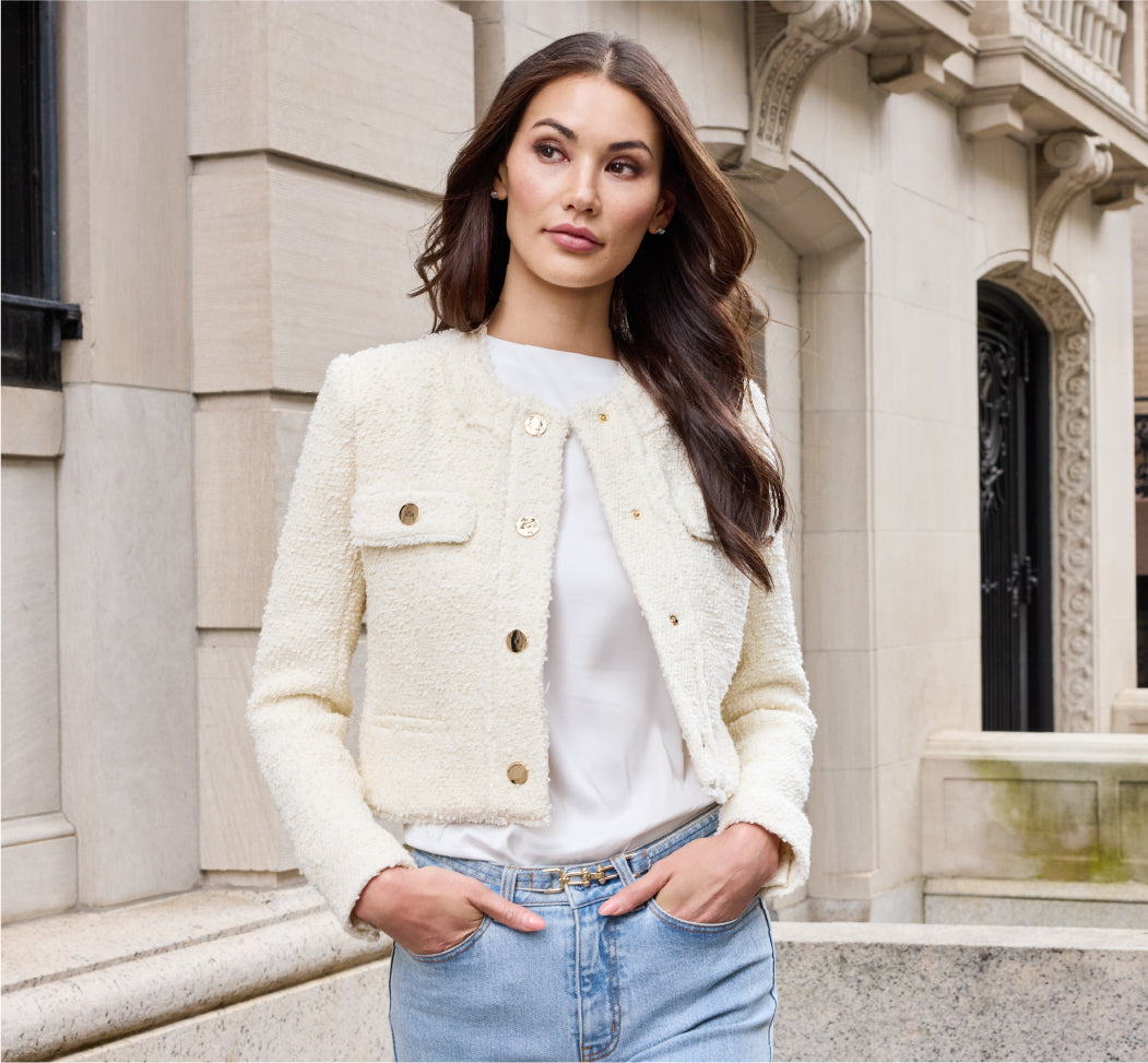 Model wearing white tweed jacket, white tee shirt and jeans