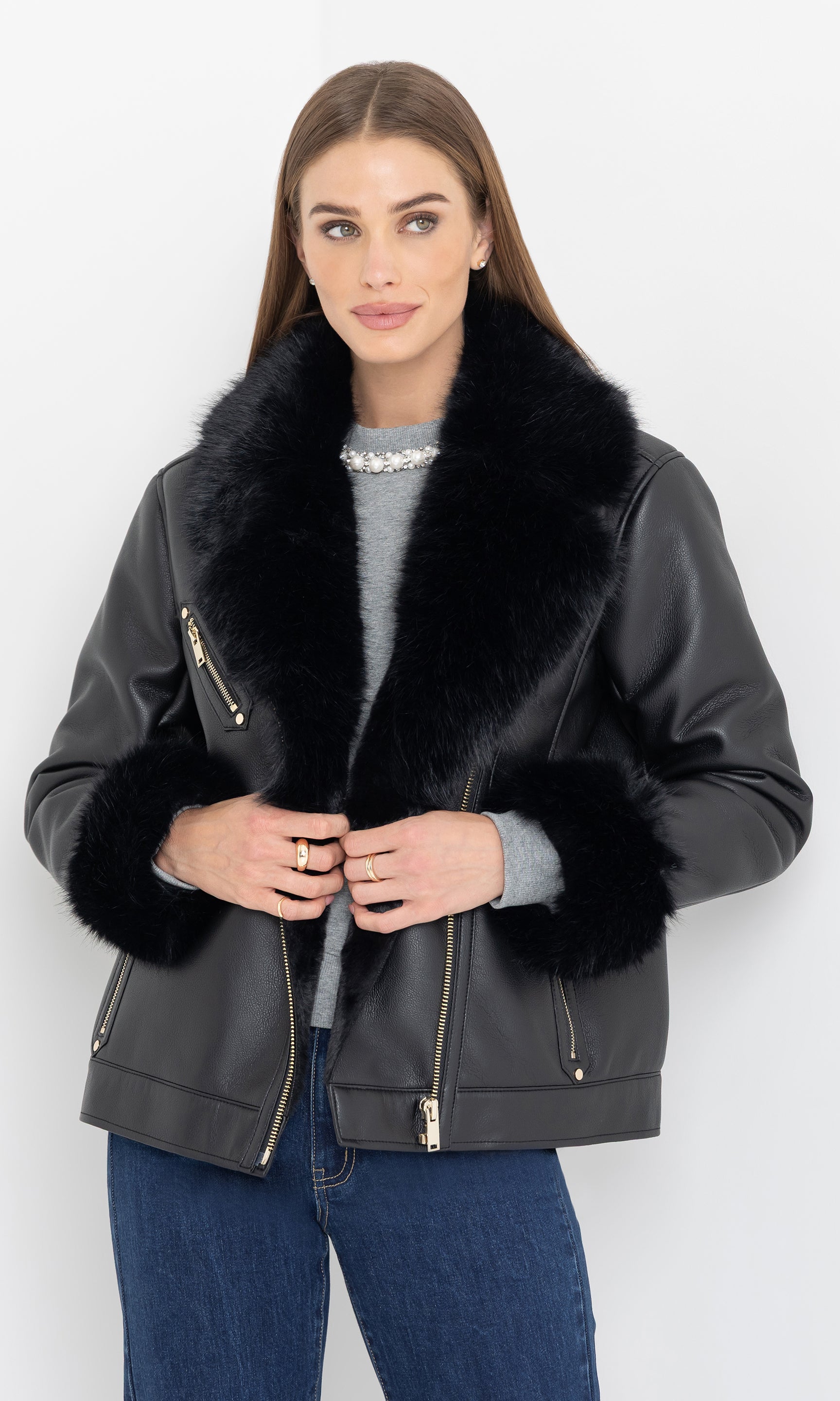 Front view of the model wearing the walt faux fur shearling moto jacket with oversized collar.