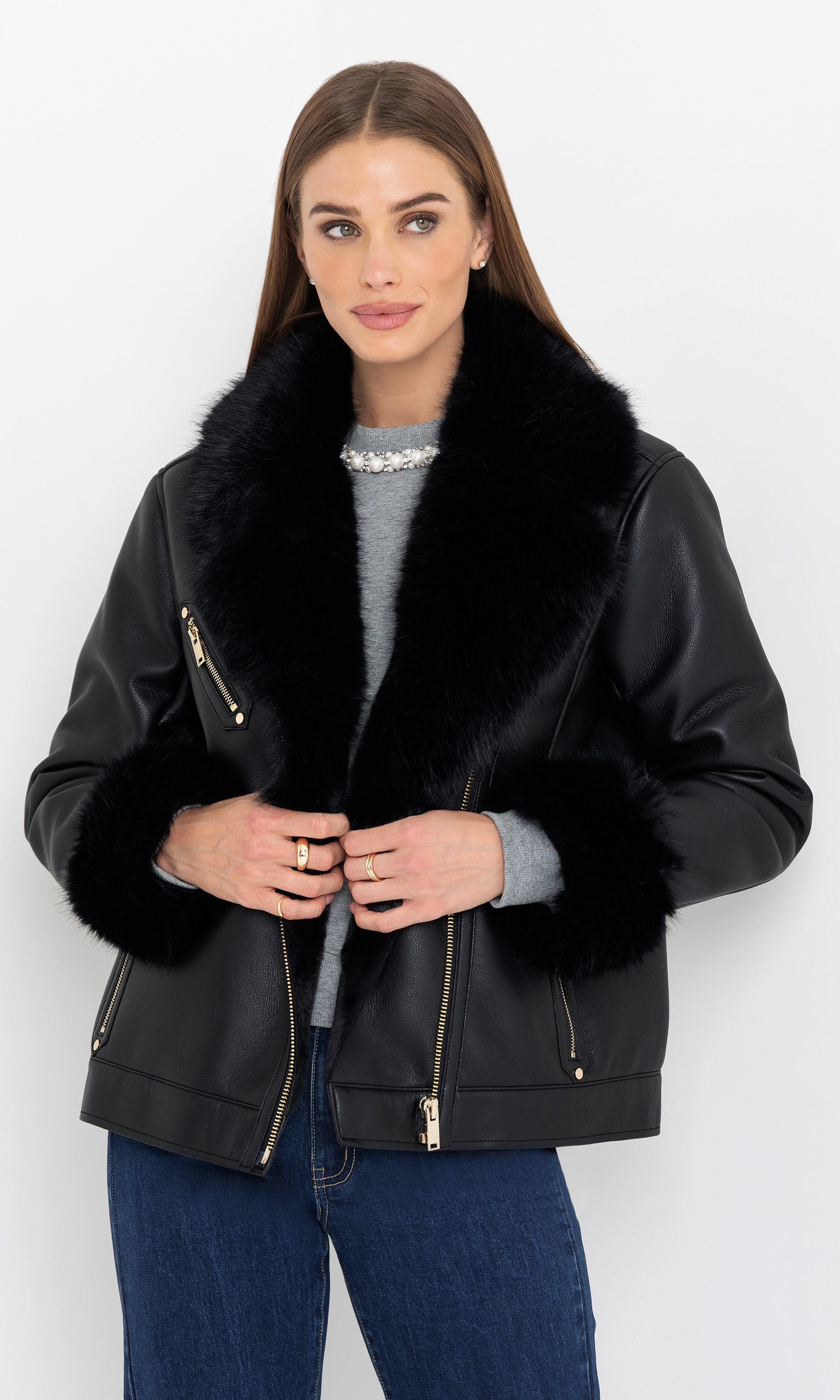 Front view of the model wearing the walt faux fur shearling moto jacket with oversized collar.