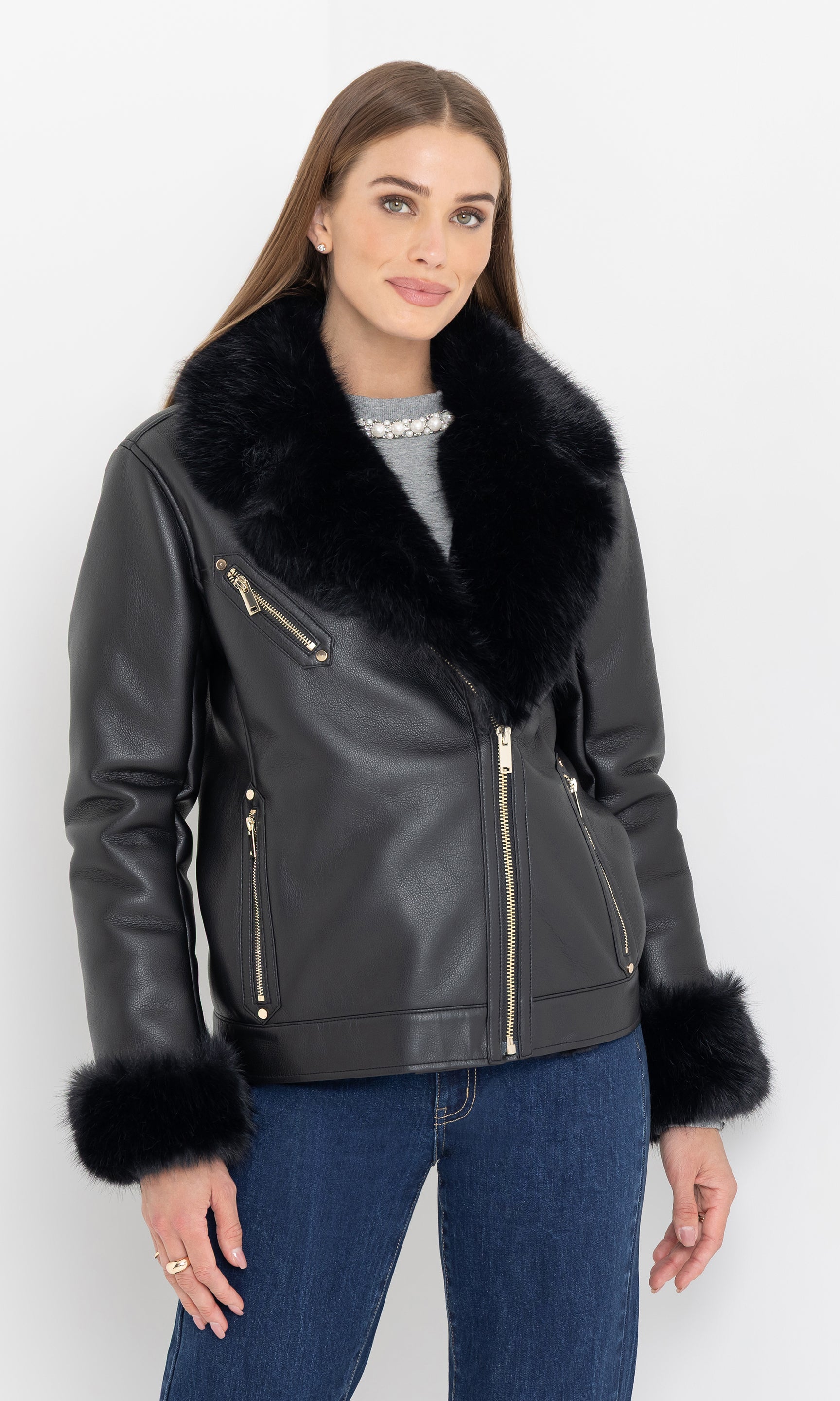 Full body view of the walt faux fur shearling moto jacket styled with denim.