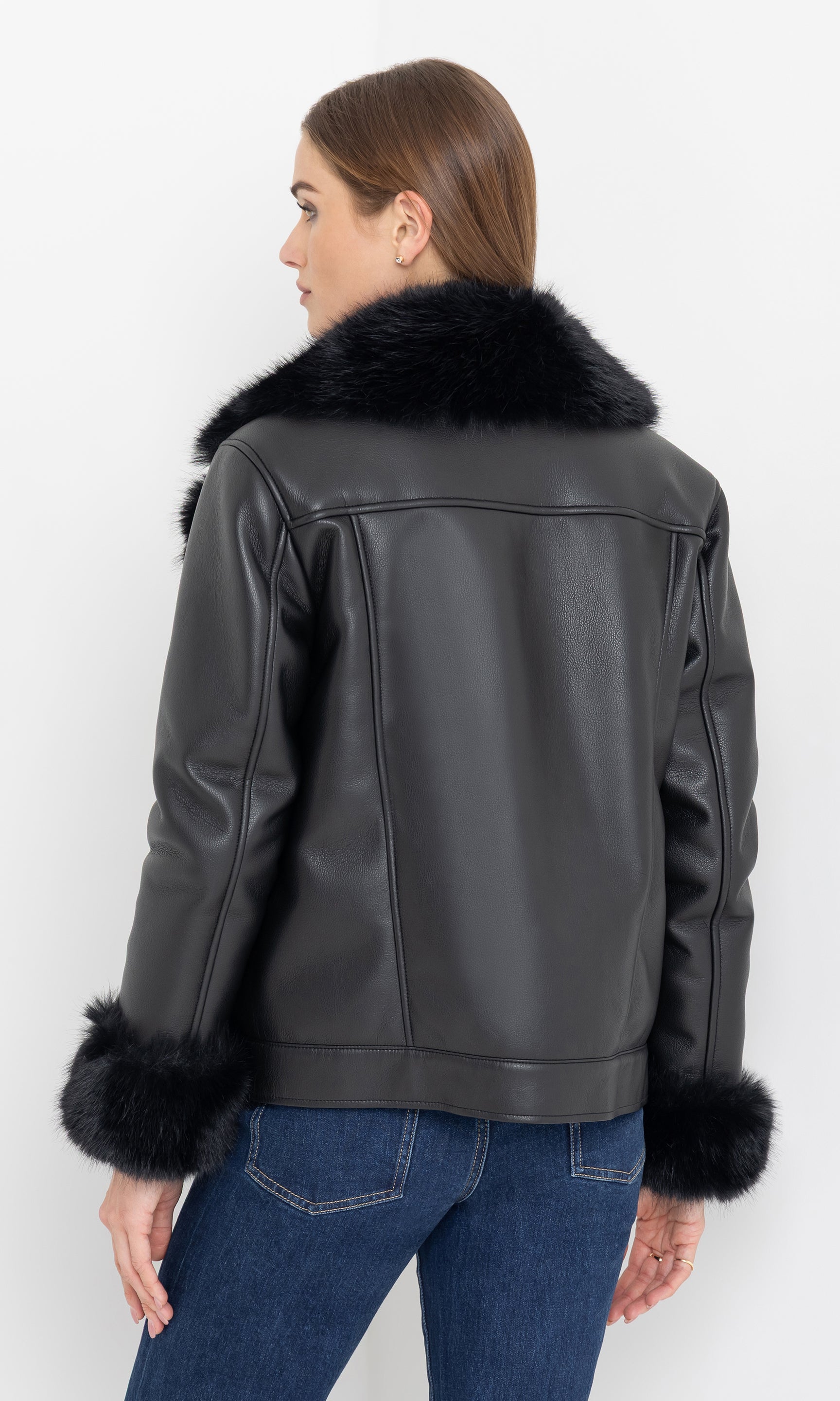 Rear view showing the relaxed fit and panel detailing of the moto jacket.