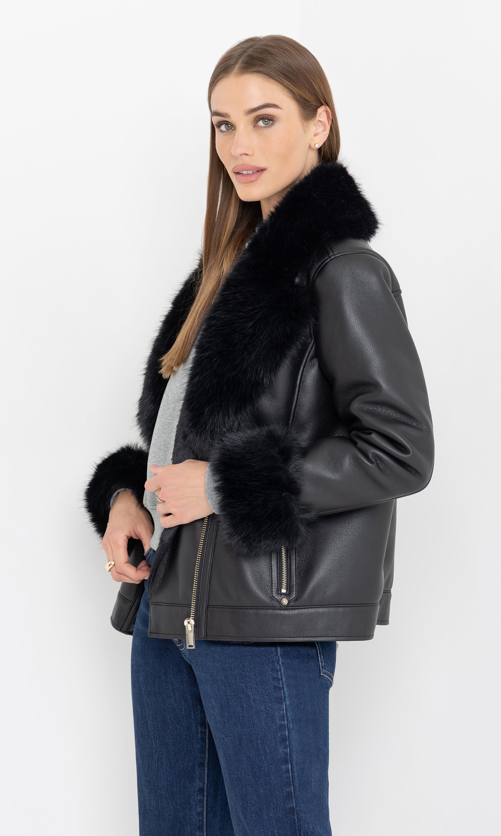 Side view of the jacket emphasizing the faux fur cuffs and structure.