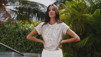 Video of two women wearing different summer sequin outfits: tops, skirts, and dresses.